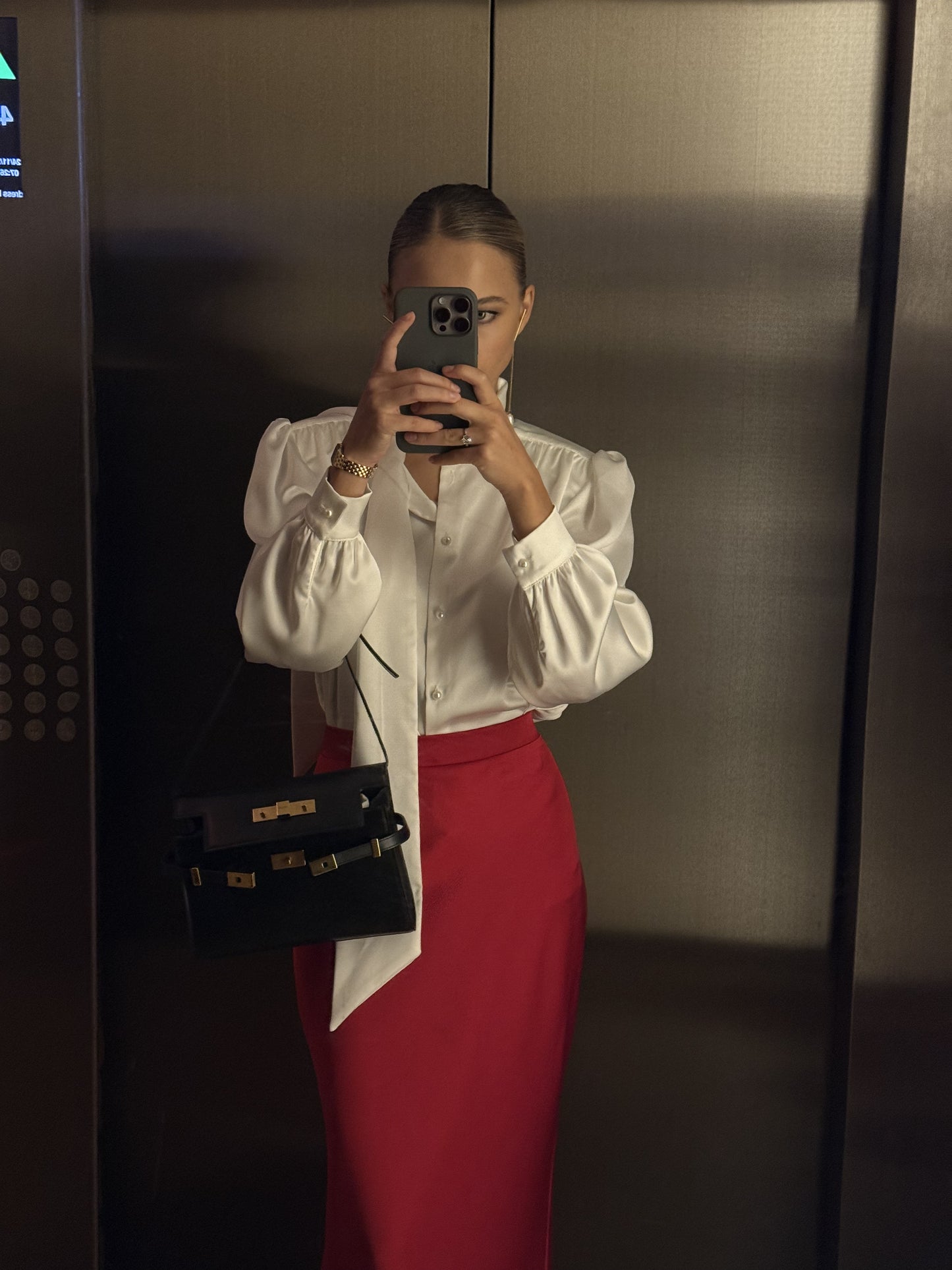 Blouse with accent shoulders and long sleeves with cuffs