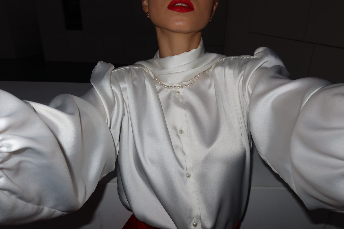 Blouse with accent shoulders and long sleeves with cuffs