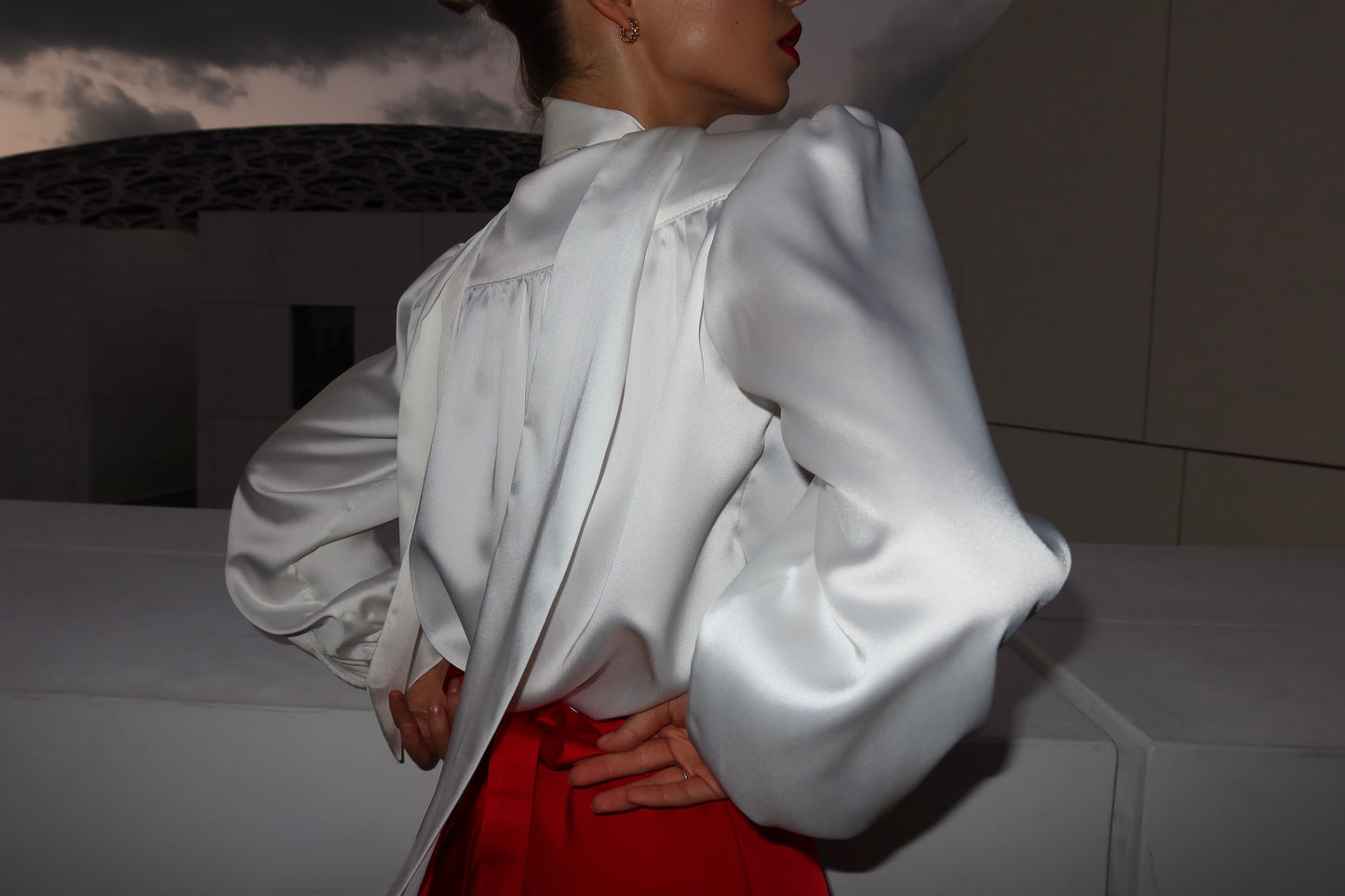 Blouse with accent shoulders and long sleeves with cuffs