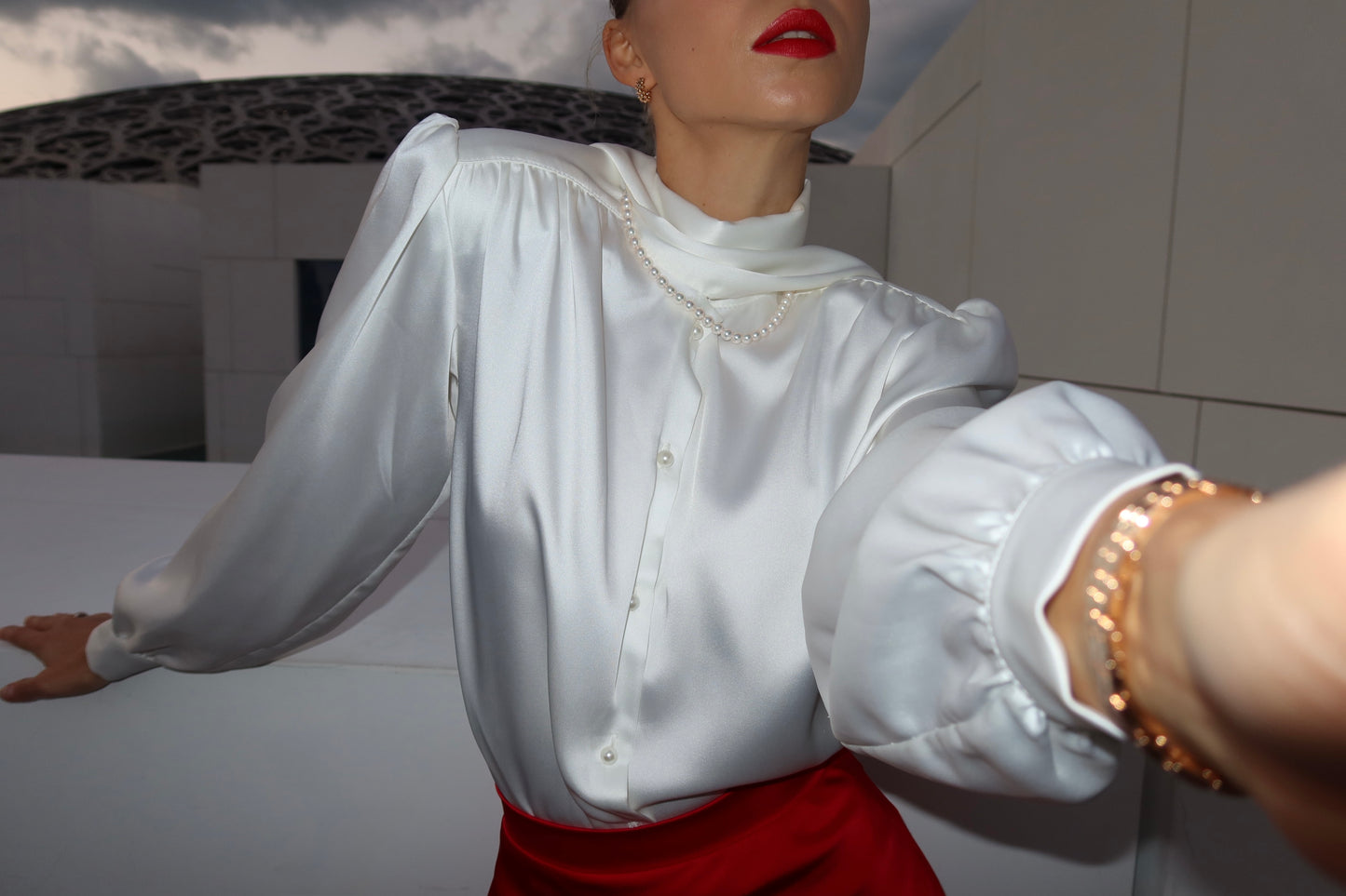 Blouse with accent shoulders and long sleeves with cuffs