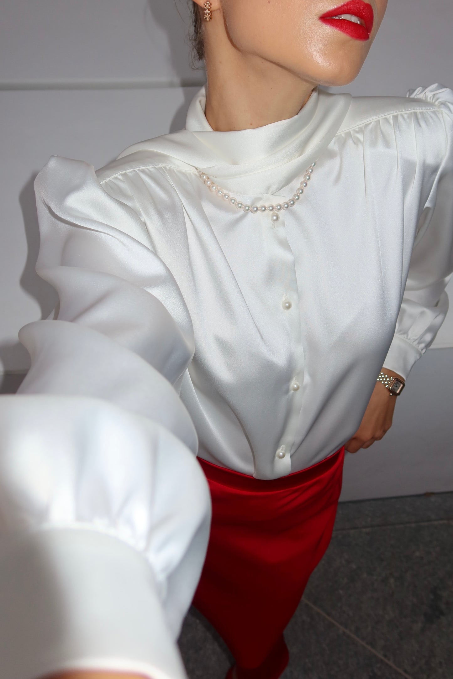 Blouse with accent shoulders and long sleeves with cuffs