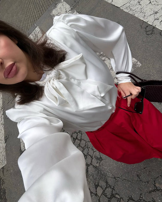 Blouse with accent shoulders and long sleeves with cuffs